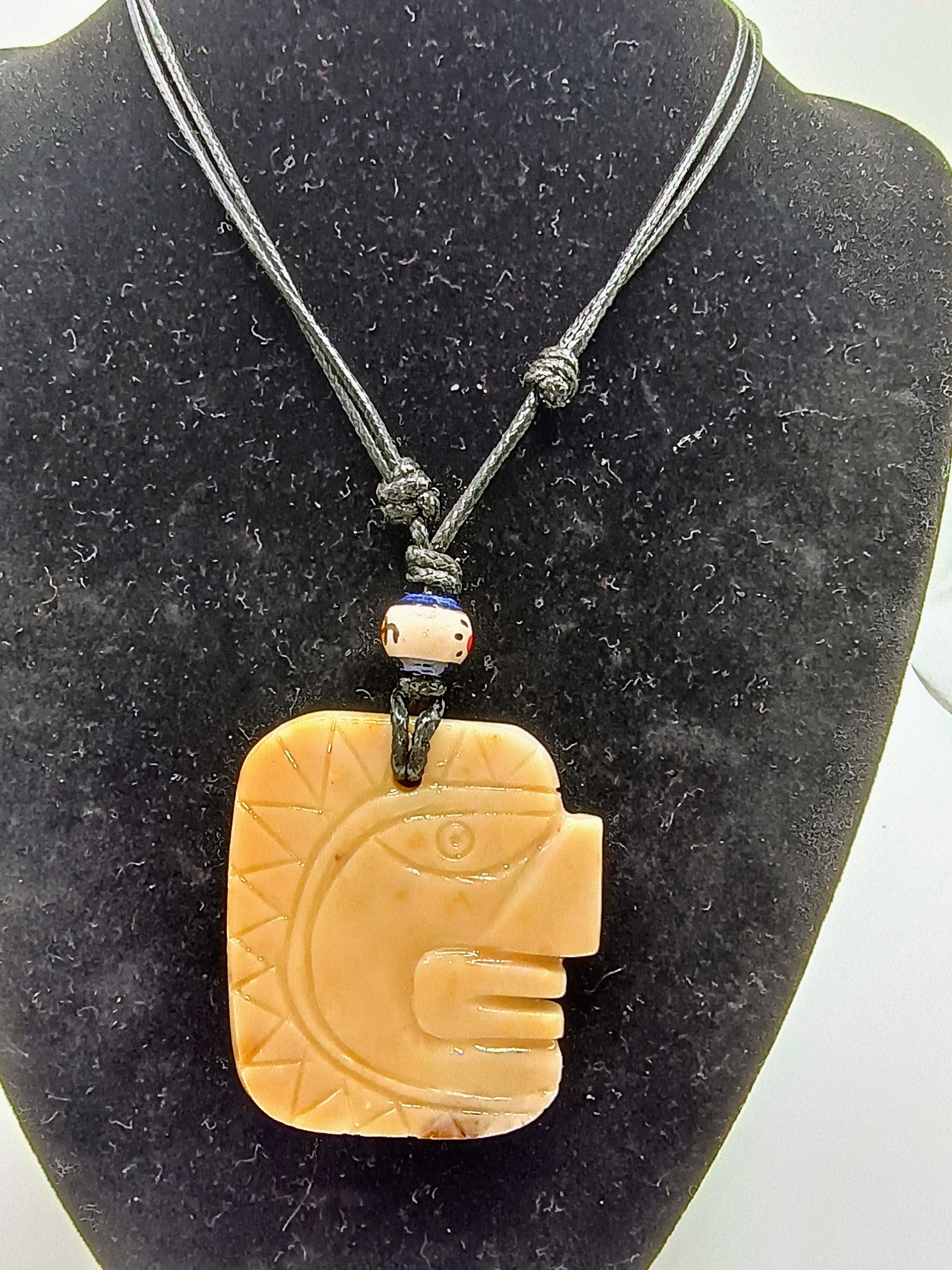 Hand-carved natural stone necklace with Inca face pendant