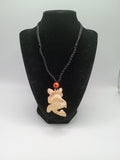 This unique, hand-carved bone pendant necklace features a stunning pendant craft