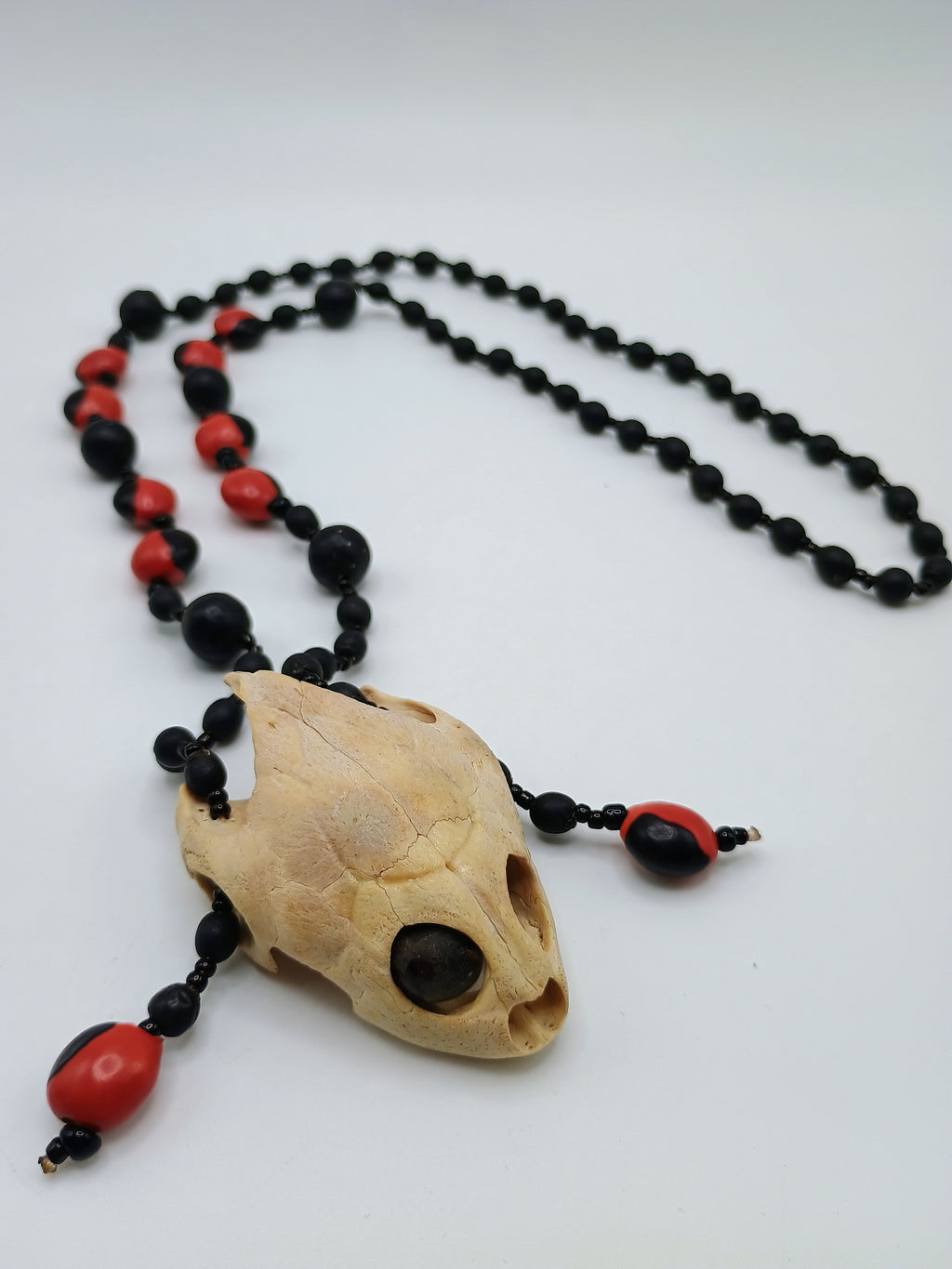 Handmade Necklace with Huayruro Seeds and a Protective Turtle Skull