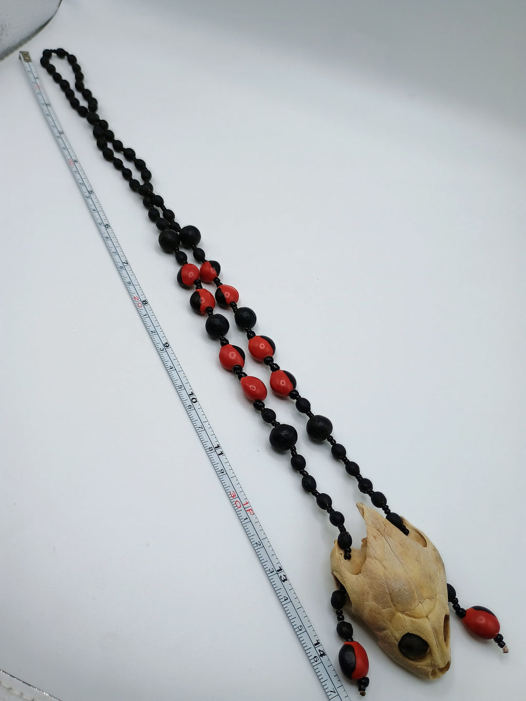 Handmade Necklace with Huayruro Seeds and a Protective Turtle Skull