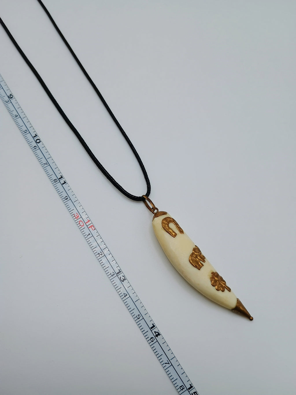 Lucky Amulet Necklace with Collected Sea Lion Bone and Golden Symbols