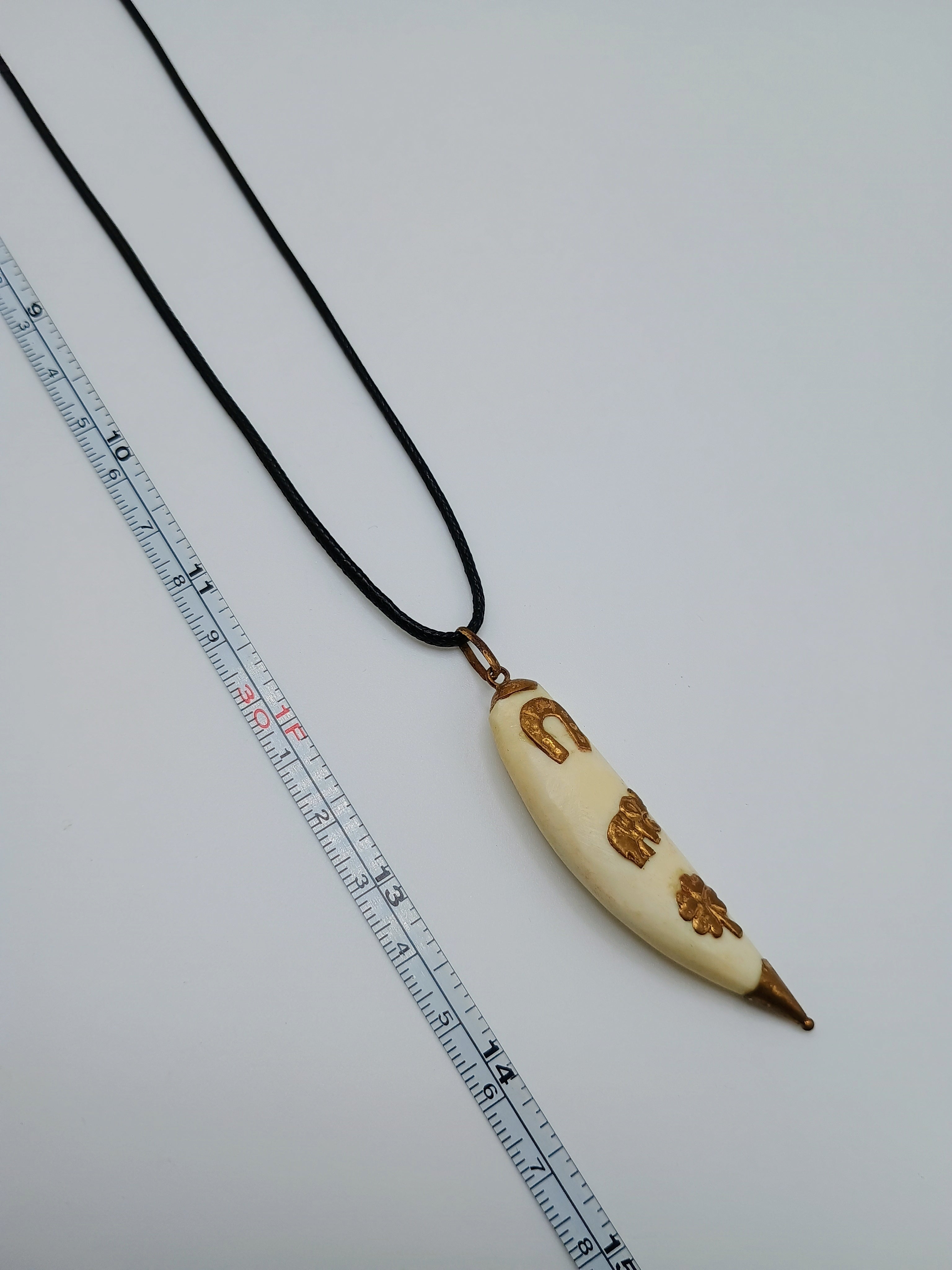Lucky Amulet Necklace with Collected Sea Lion Bone and Golden Symbols