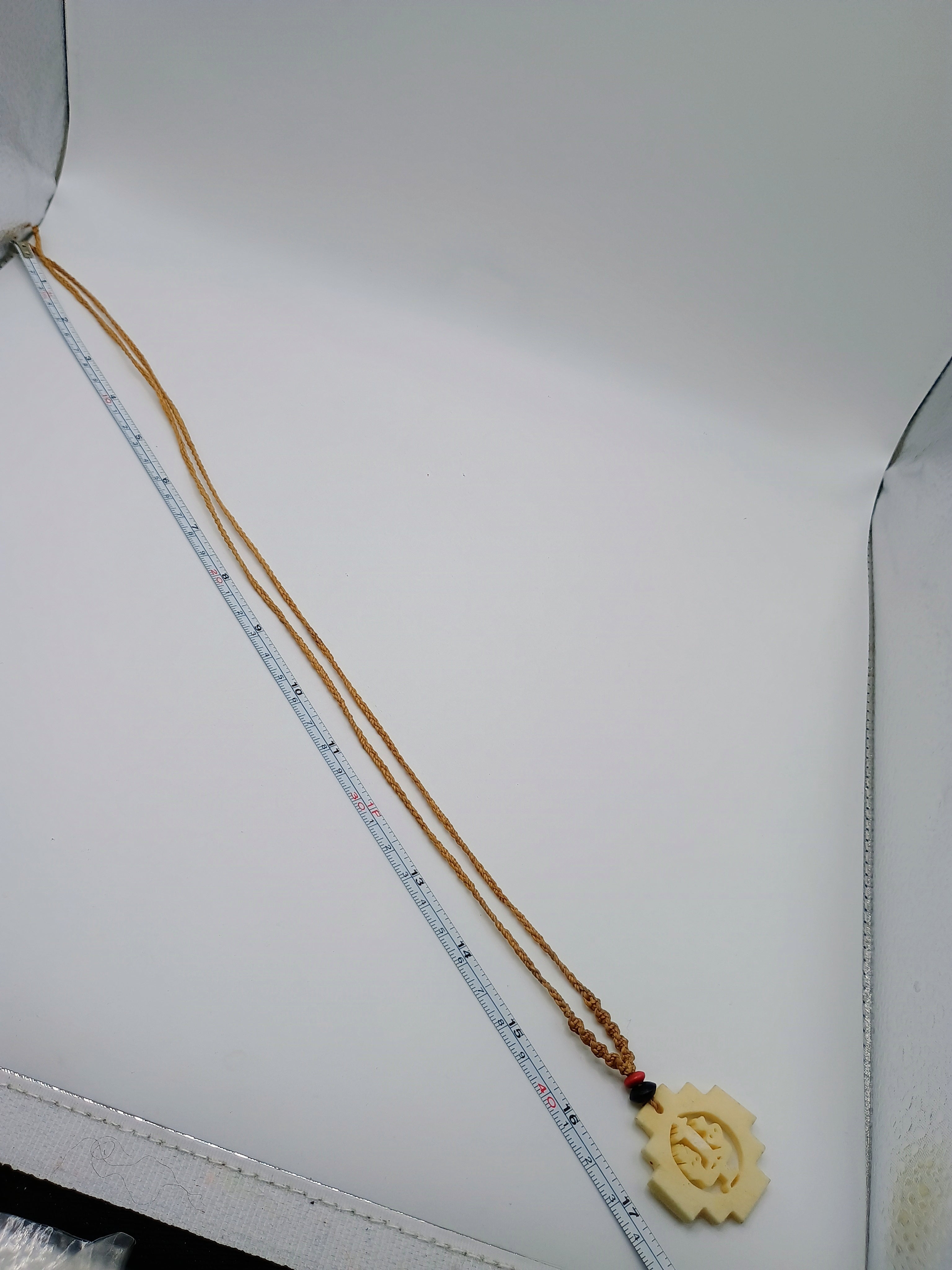 Hand-carved Chakana necklace, Andean cross, macrame thread, spiritual craftsmanship