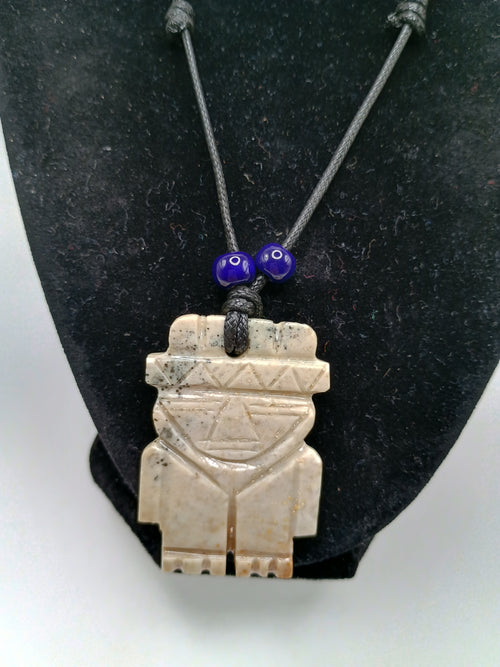 Hand-carved natural stone necklace with an ancestral style pendant and adjustable cord.