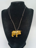 Hand-carved Palo Santo necklace with a handmade bull pendant, amulet for strength and protection.