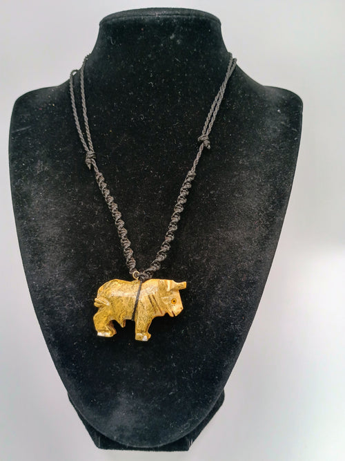 Hand-carved Palo Santo necklace with a handmade bull pendant, amulet for strength and protection.