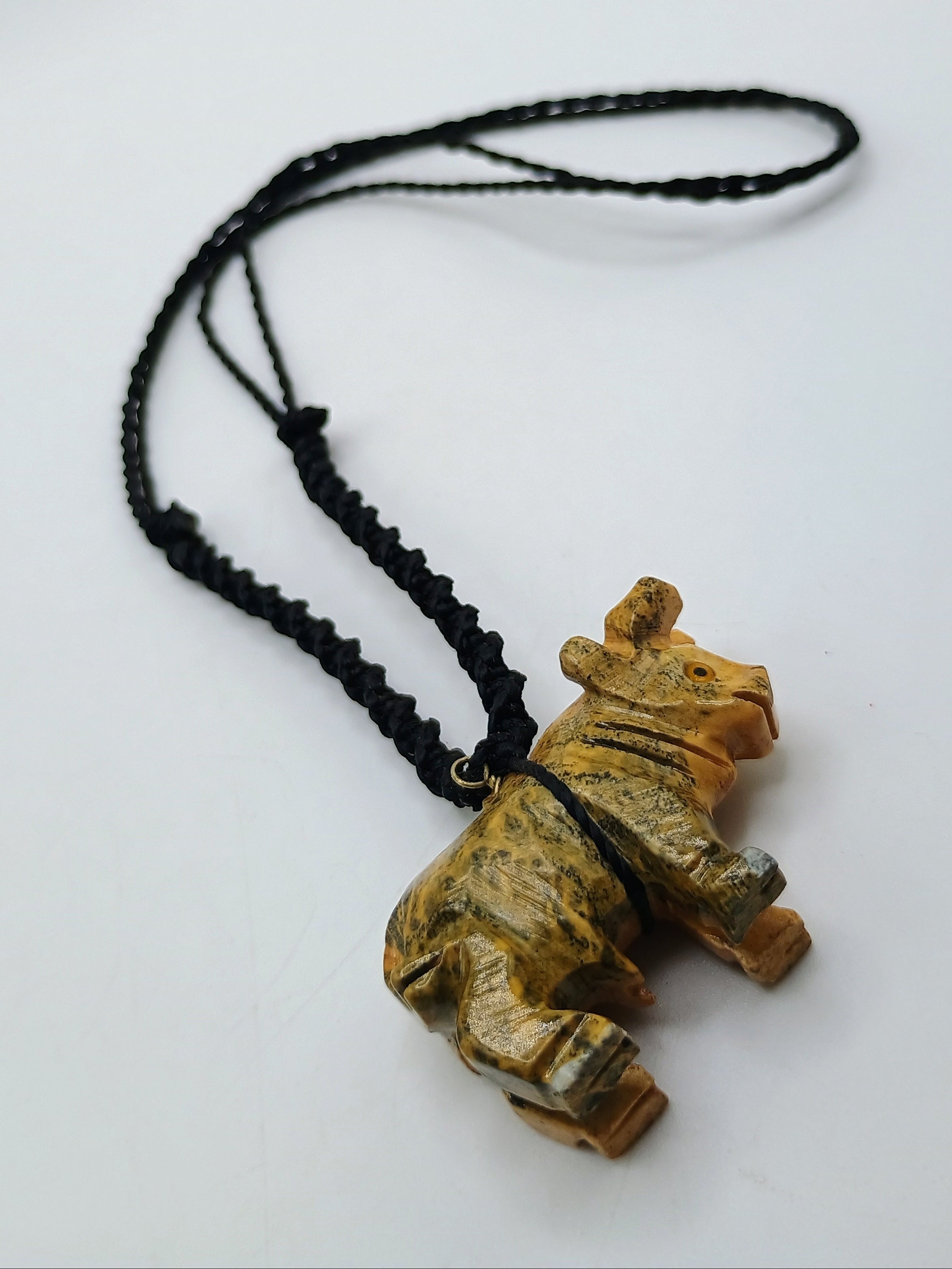 Hand-carved Palo Santo necklace with a handmade bull pendant, amulet for strength and protection.